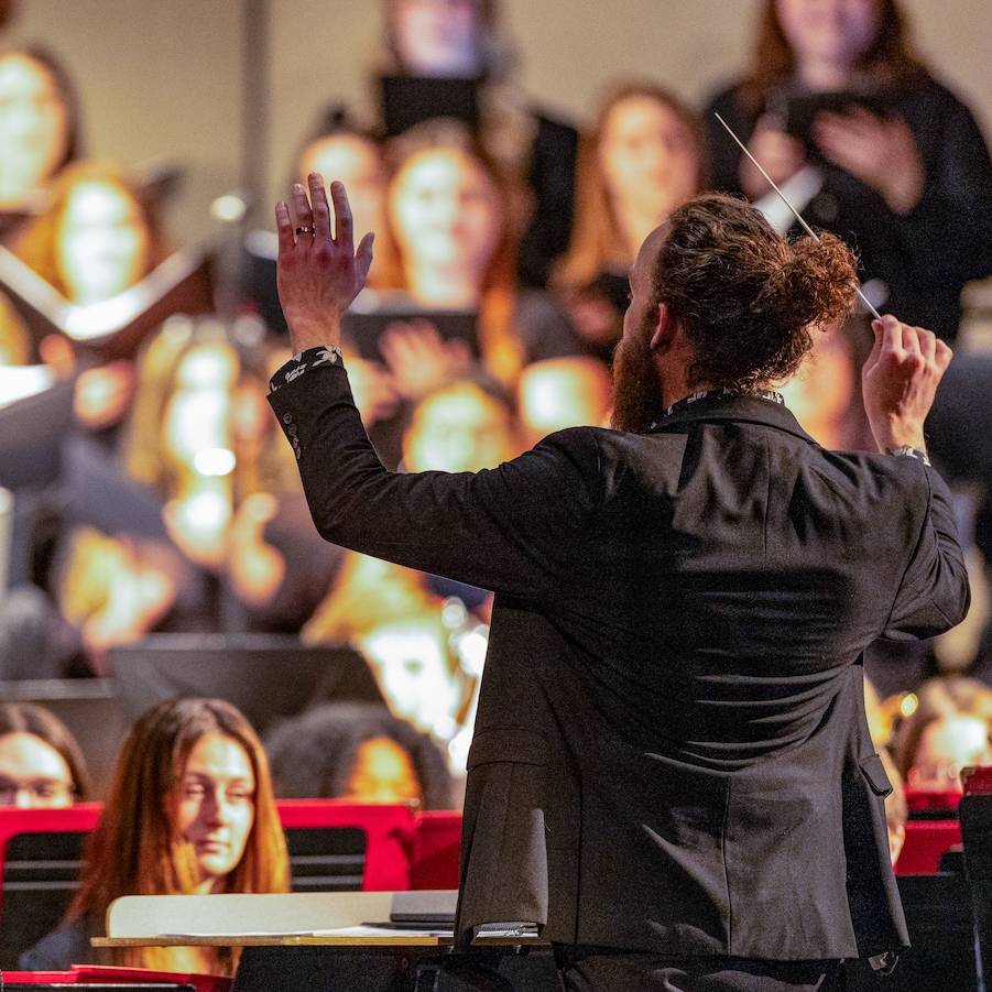 Dr. Thomas conducting