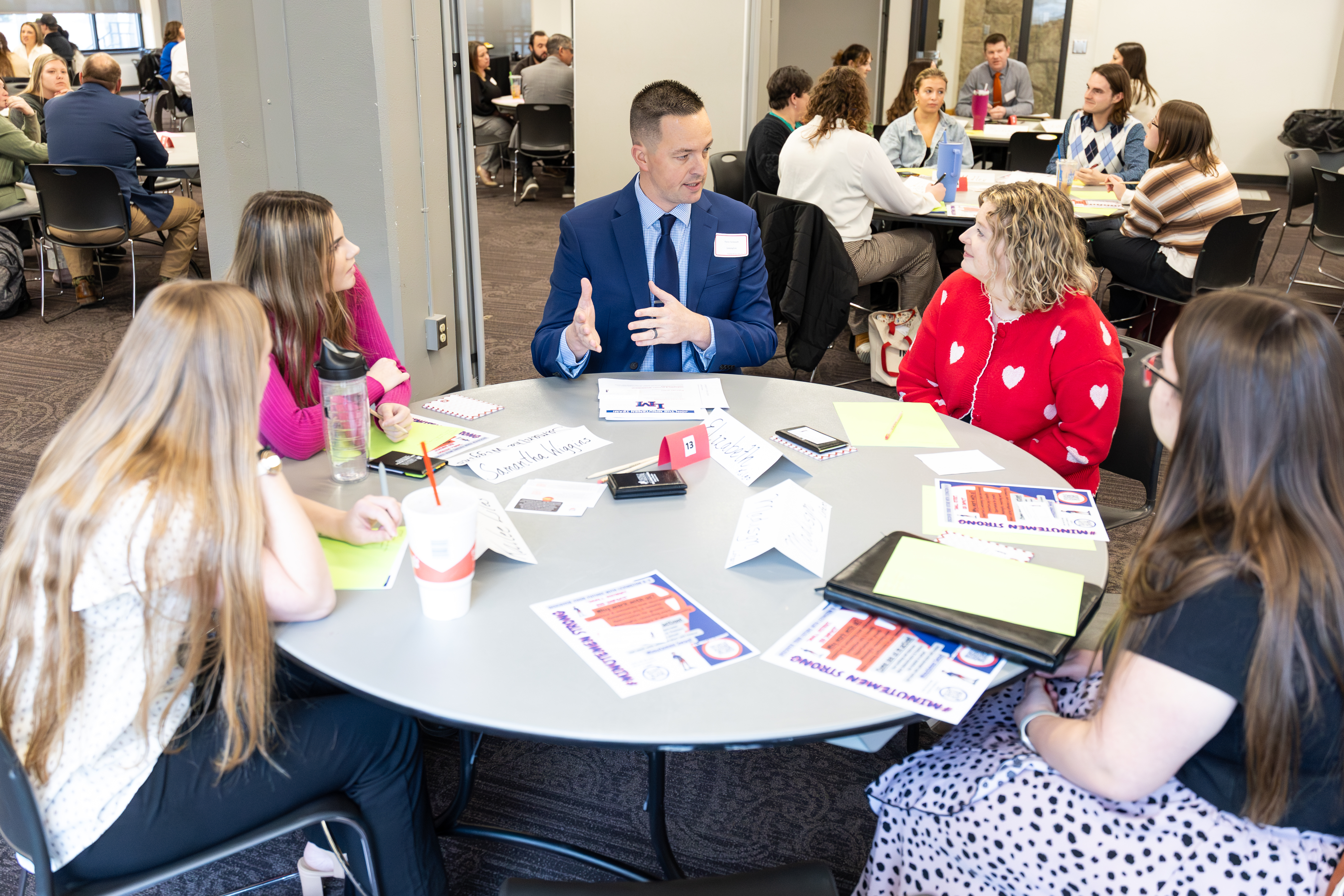 A group of educators collaborates around a table at the Rural School Summit