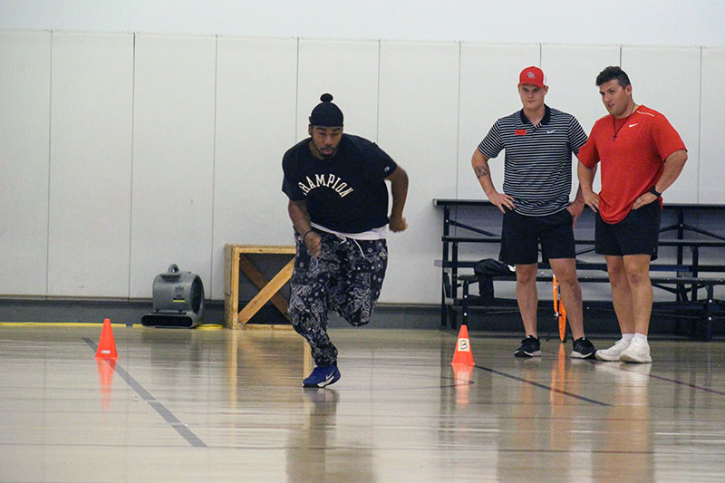 A student sprinting during a fitness challenge
