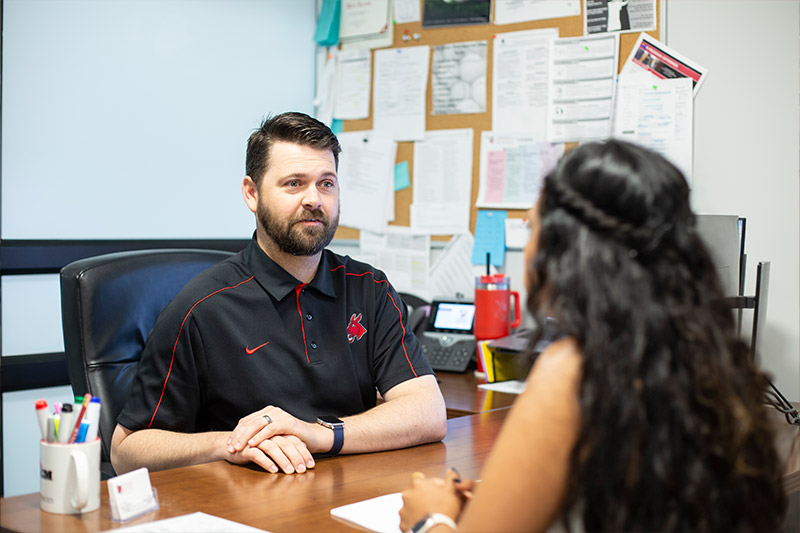 A student meeting with a success advisor