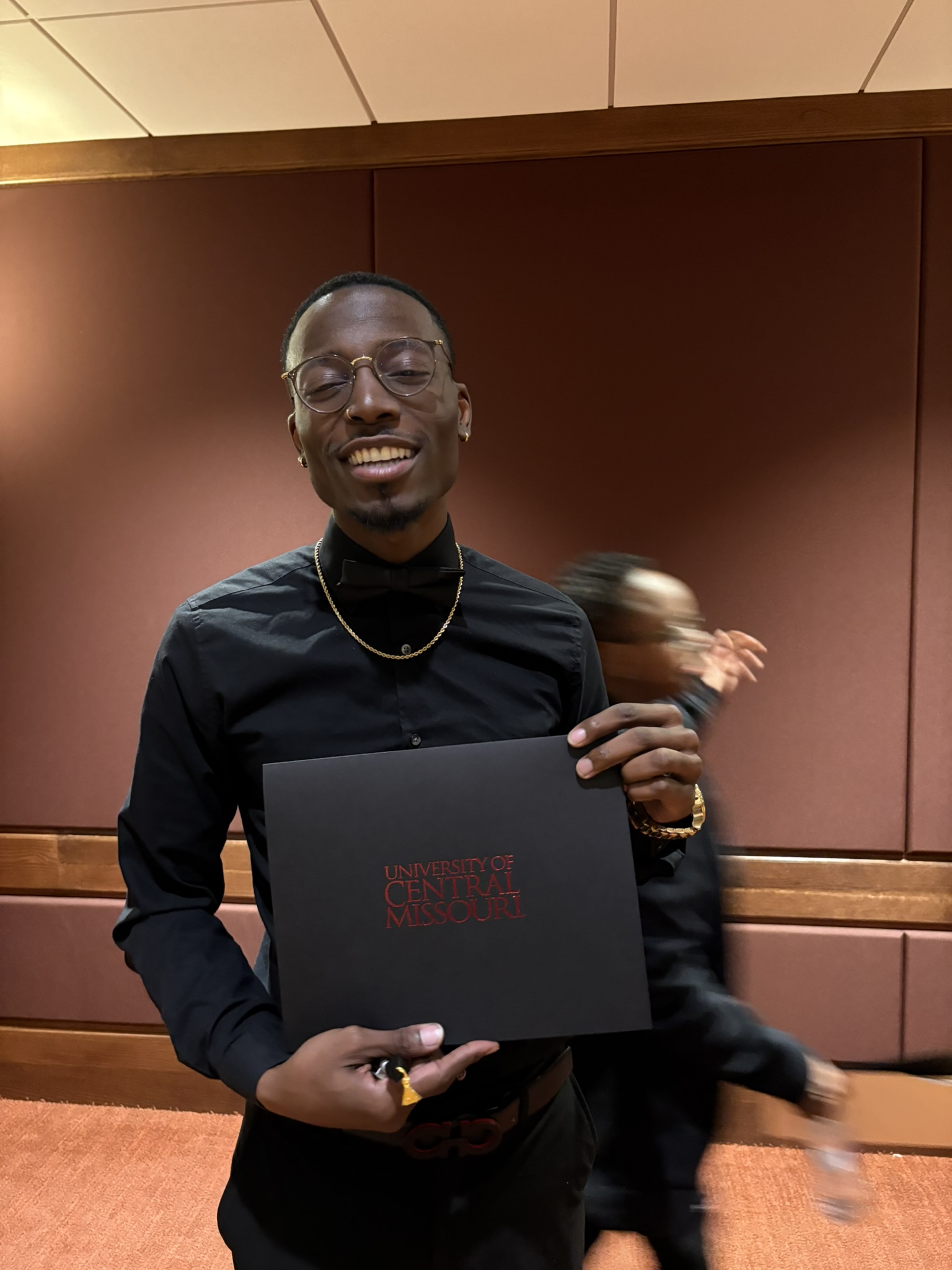 Smiling HAZMAT Removal program graduate with his certificate