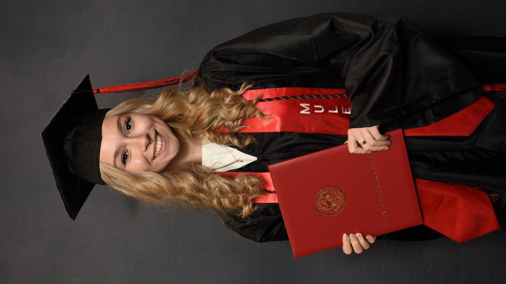 Darby Mostaffa First Place Headshot